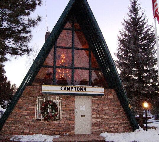 A building with a large window and a sign on the front.