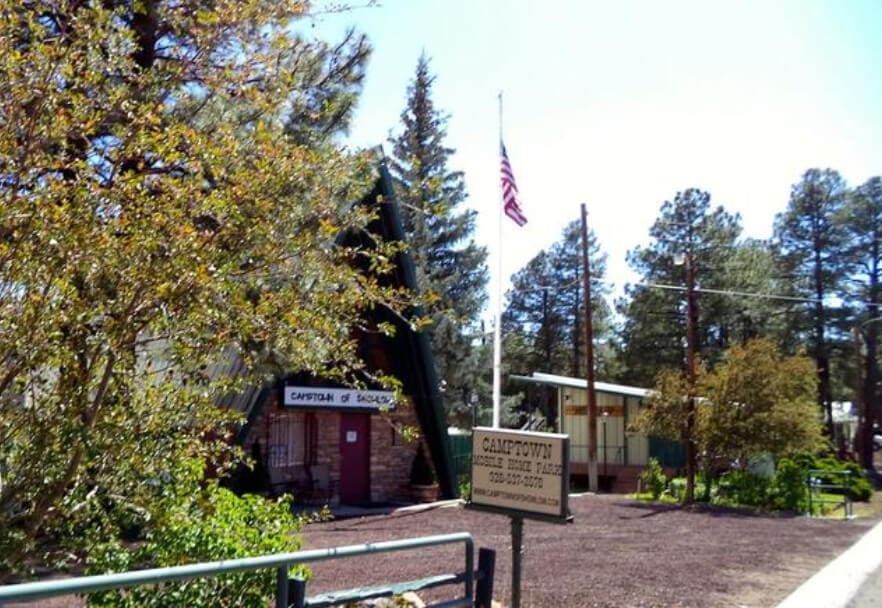 A small town with a flag flying at half mast.